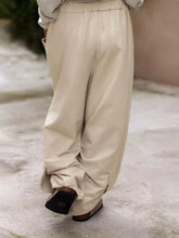 Plus size relaxed fit casual beige wide-leg trousers with elastic waistband and flowing silhouette for comfort
