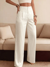 White high-waisted wide-leg pants featuring a delicate lace waist trim for an elegant and breathable style