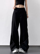 Black wide leg high waist trousers with a relaxed, flowing silhouette in soft fabric for comfortable wear