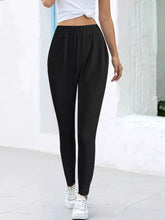 Black high-waisted casual pants with soft stretchy fabric and comfortable elastic waist for everyday wear