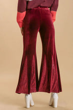 Burgundy velvet flare leg pants with sequin elastic waistband and shimmering sequined panel at the hem plus size
