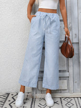 Light blue and white striped wide leg pants with a drawstring waistband for comfortable casual wear