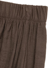 Brown textured fabric casual wide leg pants with elastic waistband suitable for care instructions and comfort
