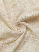 Cream-colored lace decorative button wide leg pants with intricate swirling patterns and delicate textured weave