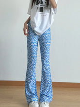 Floral print flare leg pants in blue featuring a vibrant floral print and a stylish flared silhouette