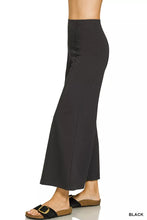 Black heavy ponte pintuck pants with elastic waistband featuring smooth tailored fabric and subtle side seam detailing