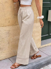 Beige linen casual drawstring wide leg pants with delicate lace trim at the hem for comfortable wear