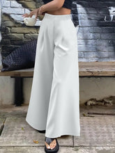 Plus size elastic waist wide leg pants in white with smooth flowing fabric and comfortable elastic waistband