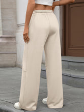Beige drawstring high waist wide leg casual pants with elastic waistband and side cargo pockets