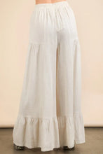 White flowing palazzo pants with ruffled hem and palazzo elastic waist comfy design for relaxed wear