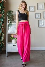 Bright pink Heimish full size tie pants with paperbag waistband and matching fabric belt for plus size wear