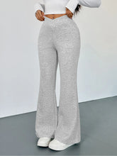 Gray heathered high waisted flare leg pants made of soft stretchy fabric offering comfortable stylish wear