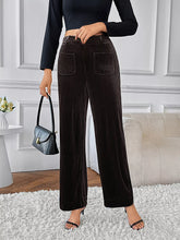 Black corduroy high-waisted wide-leg pants with a high waist and two front pockets for stylish comfort