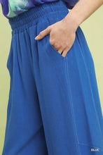 Umgee linen elastic waist wide leg pants in blue with white stitching and an elastic waistband detail