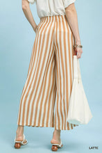 Umgee cream and beige vertical stripe wide leg pants with high waisted elastic waistband for stylish comfort