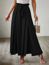 Black high-waisted wide leg pants with pleats and a self-tie belt designed for stylish comfort