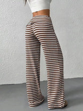 Brown and white striped wide leg pants made from lightweight fabric for comfortable casual wear