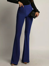 Royal blue high-waisted flared pants with a sleek form-fitting silhouette offering a perfect fit for stylish wear