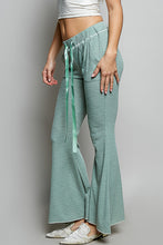 Light green POL drawstring textured ribbed knit pants in ribbed knit fabric with flared legs and side slits