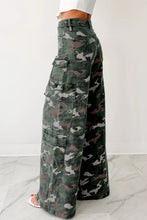 High waist cargo pants in faded green brown and gray camo print made of denim with wide-leg fit