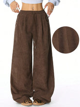 Brown corduroy wide leg drawstring pants with side pockets and adjustable waist for comfortable wear