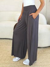 Gray basic bae wide leg pants with elastic wide waistband and side pockets featuring easy care instructions