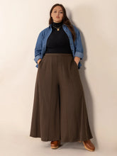Brown pleated plus size wide leg trousers with pockets featuring a comfortable wide leg design for stylish wear