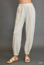 Beige cotton umgee drawstring jogger pants with elastic waistband ribbed cuffs and front seam detail
