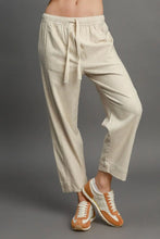 Beige linen joggers with drawstring elastic waistband and cuffed ankles from umgee full size linen blend pants machine wash cold