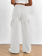 Light gray casual high waist cargo pants with soft fabric wide-leg design and functional side pockets