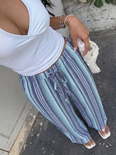 Blue and white striped wide-leg pants with a drawstring waist offering a perfect fit and stripe pattern design