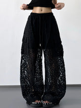 Black lace wide leg pants with drawstring waist and layered sheer fabric for elegant wide leg pants style