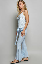 Light blue textured ribbed knit flare pants with matching tie belt made from breathable knit fabric