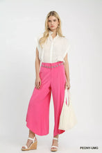 Fuchsia umgee flowy asymmetrical hem wide leg pants featuring a decorative beaded belt detail for elegant wear