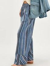 Blue and white striped wide leg pants made of lightweight flowing fabric for comfortable stylish wear