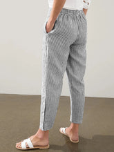 Full size striped black and white linen trousers with side button detail offering all-day comfort and a perfect fit