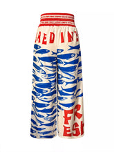 Plus size printed cream wide leg pants with bold blue fish print red fresh text and matching red elastic waistband
