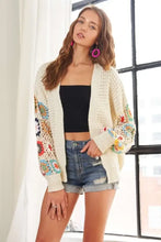 Contrast crochet open long sleeve cardigan with floral embellishments