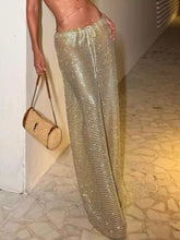 Shimmering gold mesh drawstring wide leg pants with a comfortable drawstring waist for stylish wear