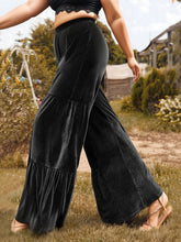 Plus size velvet ruffle hem wide leg pants in black with tiered ruffles detail for elegant styling