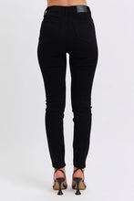 Black high-waisted judy blue plus size faux leather skinny pants with sleek form-fitting design and subtle stitching details
