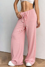 Pink and white gingham check ribbed knit drawstring wide leg pants with a comfortable adjustable waist detail