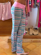 Pastel-striped wide-leg drawstring striped pants with pink elastic waistband and matching drawstring