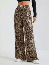 Full size leopard print wide leg pants in flowing lightweight fabric with bold brown and tan spots for plus size