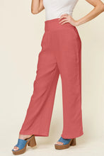 Coral-colored double take full size texture smocked waist wide leg trousers with high waist and subtle side pleats