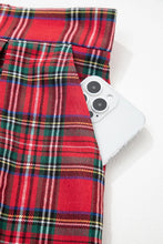 Red plaid wide-leg pants featuring a plaid pattern with green white and black stripes in a wide-leg fit