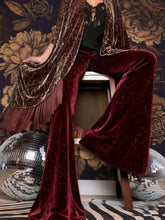 Velvet high waist flared pants in burgundy velvet with subtle glittering speckles for elegant wear