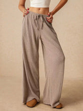 Beige corduroy wide leg pants with a drawstring waistband for comfortable and stylish leg pants
