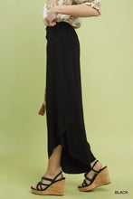 Black high-waisted Umgee wide leg trousers with a flowy asymmetrical hem perfect for stylish casual wear