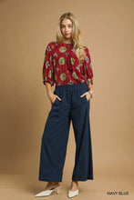 Navy blue umgee wide-leg corduroy pants with elastic waistband and relaxed fit for comfortable wear